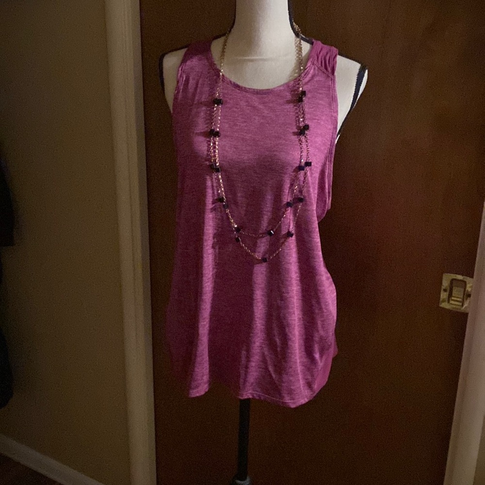 This tank top is burgundy and white on the body and burgundy